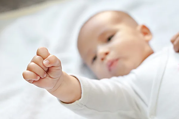 Battle for babies,strong baby showing fist — Stock Photo, Image