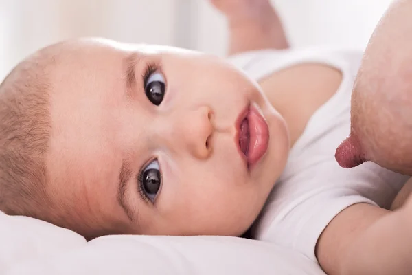 Beautiful innocence hungry baby sucking close up — Stock Photo, Image