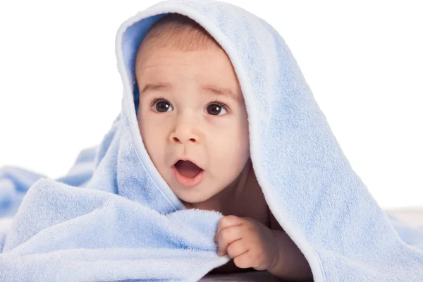 Beautiful baby under the towel after bath — Stock Photo, Image