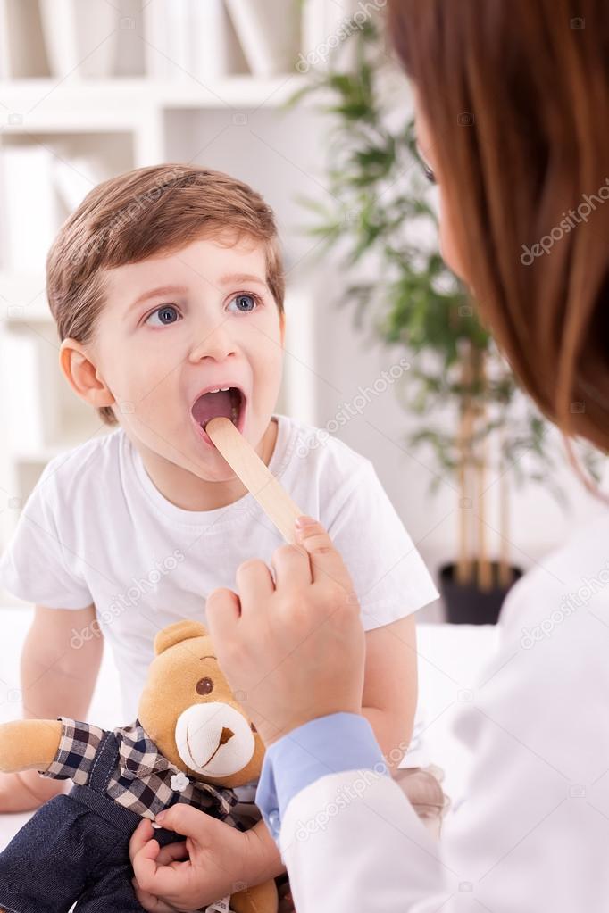 Adorable child and doctor pediatrician