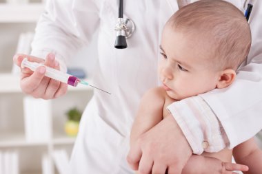 Doctor vaccinating baby clipart