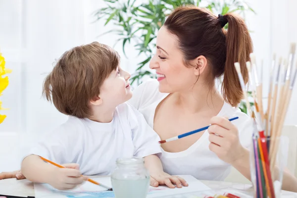 Happy love family painting and smiling together — Stock Photo, Image