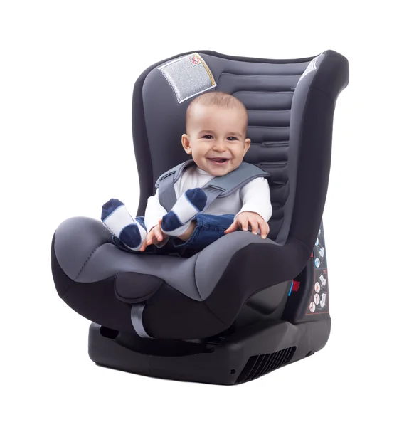 Smiling happy adorable baby sitting in car seat — Stock Photo, Image