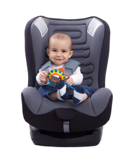 Adorable little kid sitting in a car seat — Stock Photo, Image