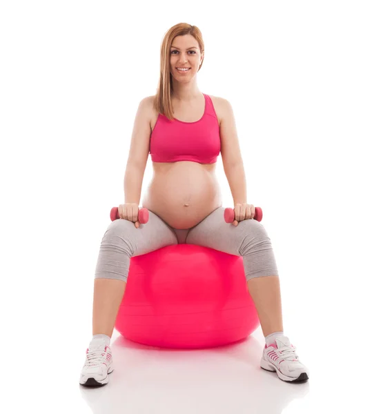 Pregnant beautiful woman exercise with ball and dumbbells — Stock Photo, Image