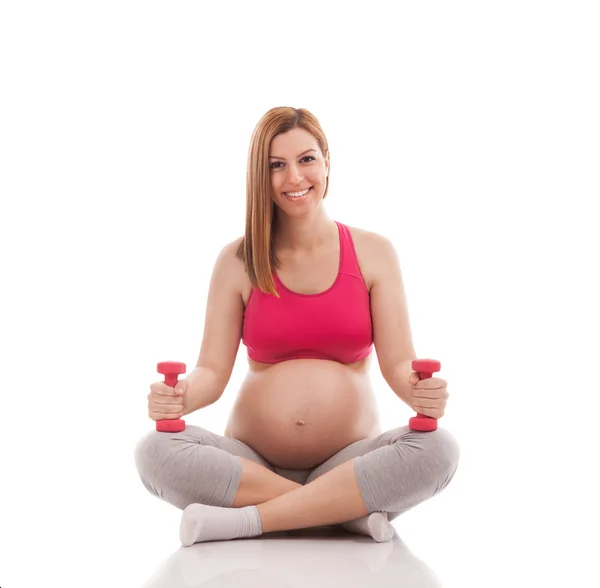 Smiling young adorable pregnant woman exercise — Stock Photo, Image