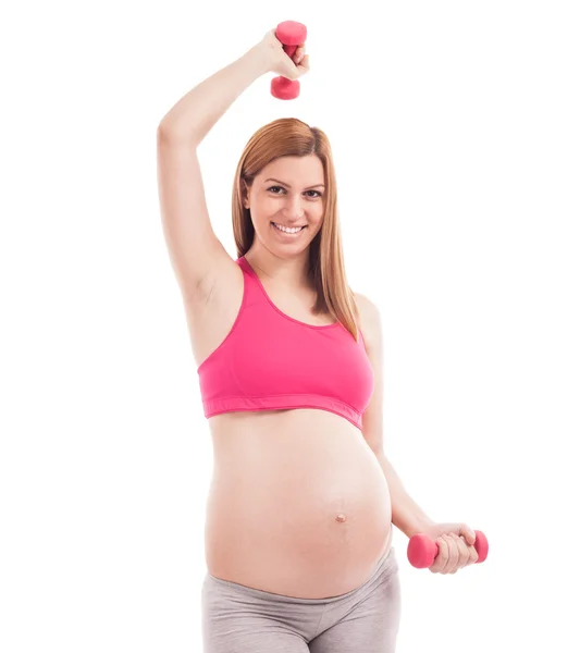 Lachende gelukkig zwangere vrouw doen oefening met dumbells — Stockfoto