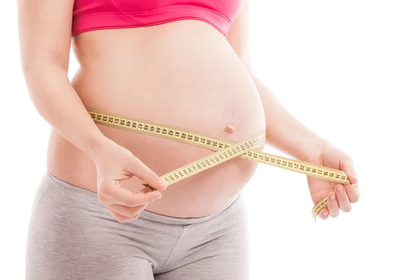 Pregnant woman holding meter, diet and healthcare — Stock Photo, Image