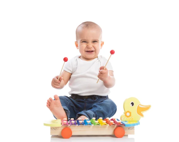 Glimlachende baby kind spelen Metallofoon — Stockfoto