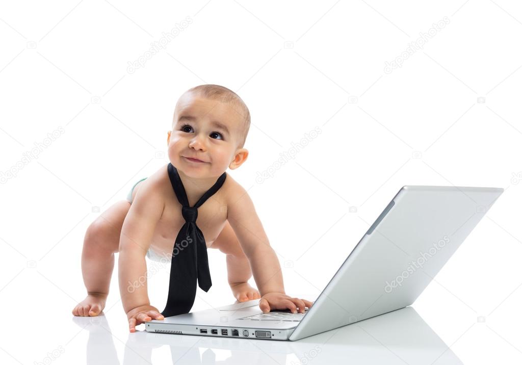 Funny little cute baby businessman with computer