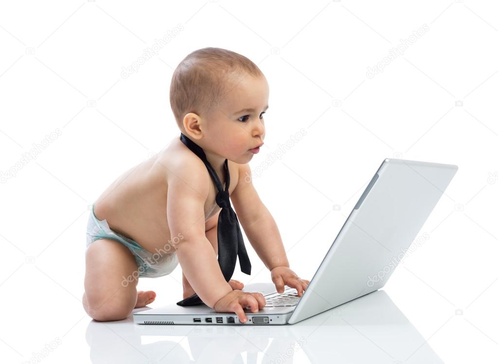 Little baby businessman working on the computer
