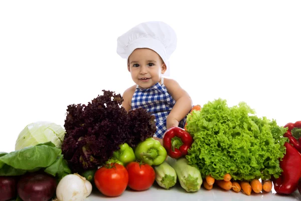 Gülen bebek aşçı sebze ile — Stok fotoğraf