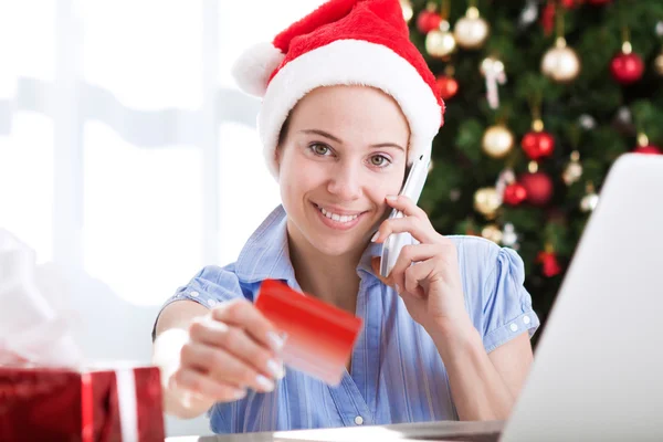 Young beautiful attractive woman holding internet credit card — Stock Photo, Image