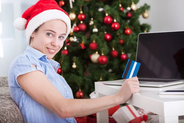 Attractive cute smiling girl holding card and shopping online — Stock Photo, Image