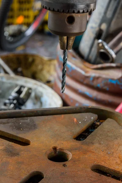 close-up of old drill machine in the shop