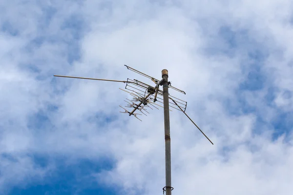 TV antenna on blue sky background — Stock Photo, Image