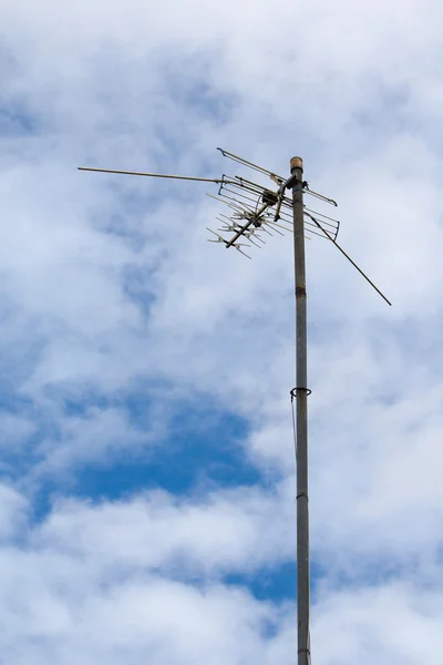 TV antenna on blue sky background — Stock Photo, Image