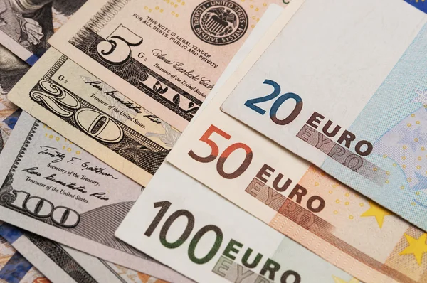 Foto de los billetes americanos y en euros —  Fotos de Stock