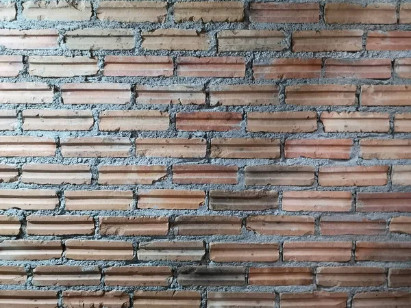 Red brick block wall show Pattern stack block rough surface texture material background Weld the joints with cement grout