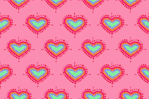 pattern of freehand sketch shape heart, colorful red green blue yeloow orange color design elements isolated on pink background, symbol love Valentine Day, textile Fabric