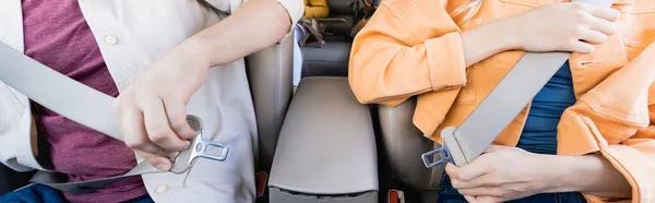 Cropped View Parents Holding Safety Belts Child Blurred Background Car — Stock Photo, Image