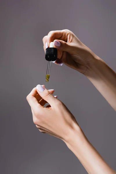 Cropped View Woman Applying Oil Pipette Fingernails Isolated Grey — Stock Photo, Image