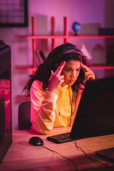 Thoughtful African American Player Headset Looking Computer Monitor Blurred Foreground — Stock Photo, Image