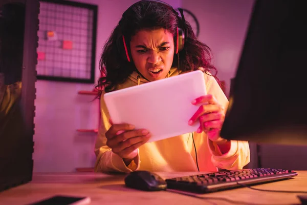 Angry African American Gamer Headset Using Digital Tablet Computer Blurred — Stock Photo, Image