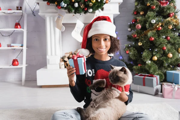 Joyful African American Girl Santa Hat Holding Gift Boxes While — Stock Photo, Image