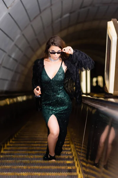 Glamour Woman Black Lurex Dress Touching Sunglasses While Looking Camera — Foto de Stock