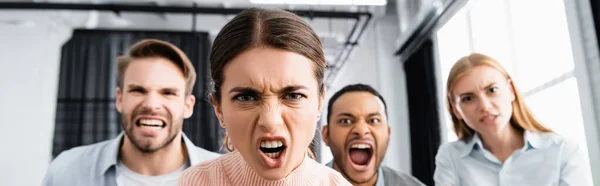 Angry Businesswoman Looking Camera Multiethnic Colleagues Blurred Background Office Banner — Stock Photo, Image