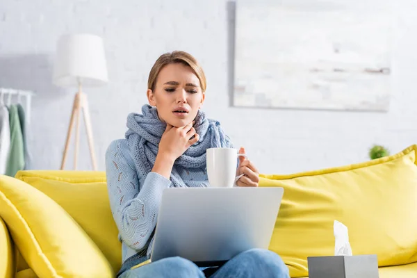 Diseased Freelancer Touching Neck While Holding Cup Laptop — Stock Photo, Image