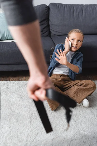 Afraid Girl Talking Smartphone Showing Stop Gesture Father Waist Belt — Stock Photo, Image