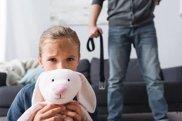 Scared Girl Soft Toy Looking Camera Abusive Father Waist Belt — Stock Photo, Image