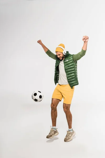 Excited Sportsman Headphones Showing Yeah Gesture While Playing Football White — Stock Photo, Image