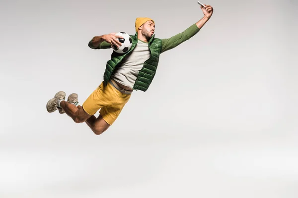 Sportsman Football Taking Selfie Smartphone While Jumping Grey Background — Stock Photo, Image