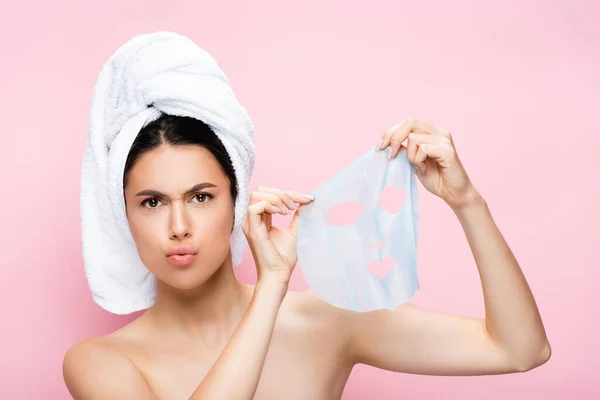 Confused Beautiful Woman Towel Head Holding Mask Sheet Isolated Pink — Stock Photo, Image