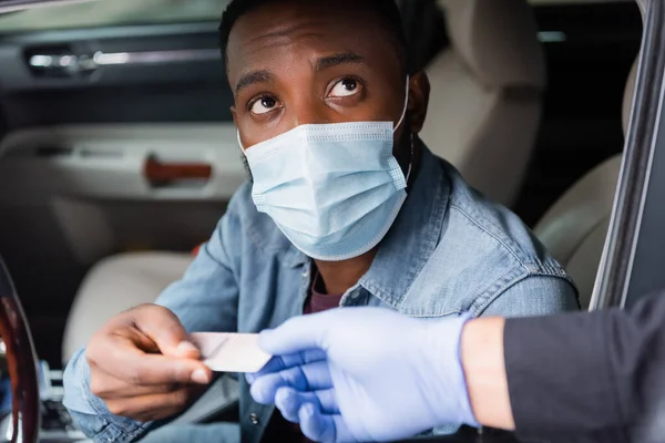 African American Driver Medical Mask Giving License Policeman Blurred Foreground — Stock Photo, Image