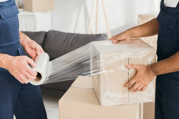 Cropped View Movers Wrapping Box Stretch Film — Stock Photo, Image