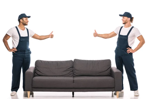 Full Length Multicultural Movers Showing Thumbs Looking Each Other Couch — Stock Photo, Image