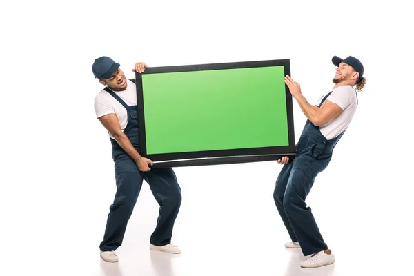 Full Length Multicultural Movers Carrying Heavy Plasma Green Screen White — Stock Photo, Image