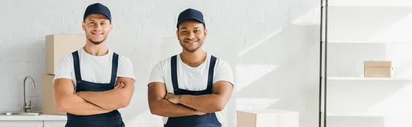 Cheerful Movers Caps Standing Crossed Arms Room Banner — Stock Photo, Image