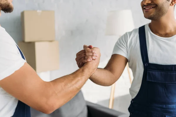 Partial View Smiling Multicultural Workers Shaking Hands Apartment — Stock Photo, Image