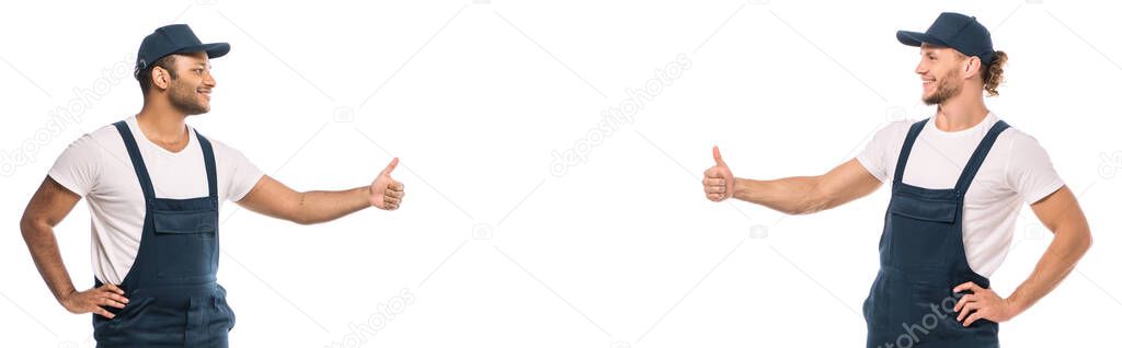 multicultural movers showing thumbs up and looking at each other isolated on white, banner