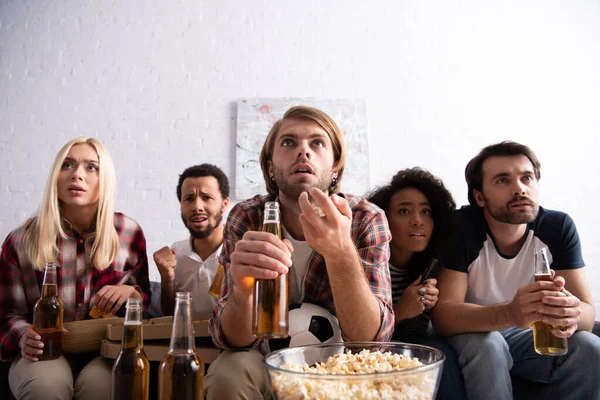 Worried Man Gesturing While Holding Beer Watching Football Championship Multiethnic — Stock Photo, Image