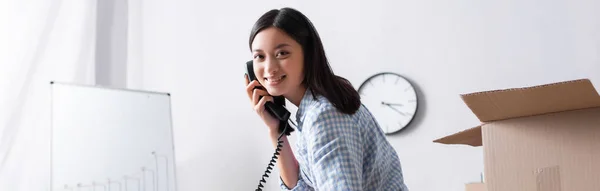 Smiling Asian Volunteer Looking Camera While Talking Telephone Carton Box — Stock Photo, Image
