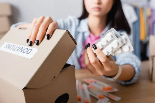 Cropped View Pills Carton Box Donations Lettering Hands Volunteer Blurred — Stock Photo, Image