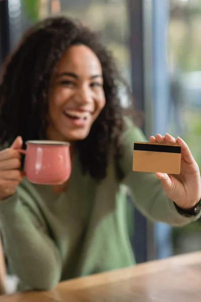 Credit Card Cup Hands Cheerful African American Woman Blurred Background — Stock Photo, Image