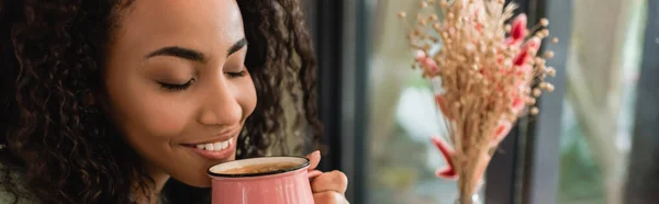 Pleased African American Woman Holding Pink Cup Coffee Cafe Banner — Stock Photo, Image