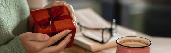 Cropped View African American Woman Holding Wrapped Christmas Present Cafe — Stock Photo, Image